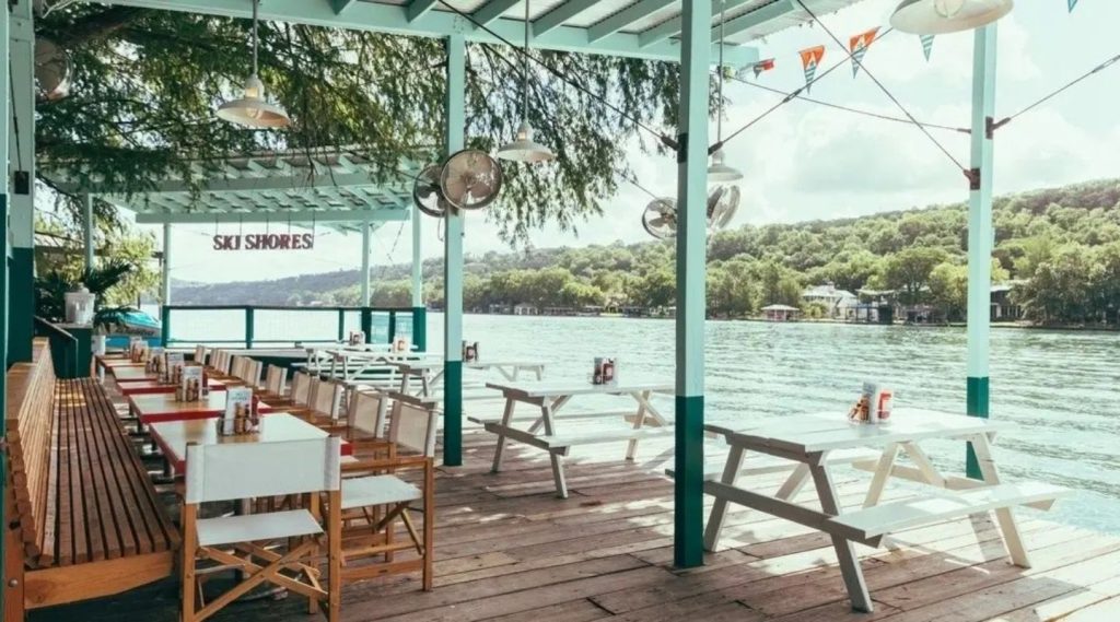 old school ski shores with tables and the water behind